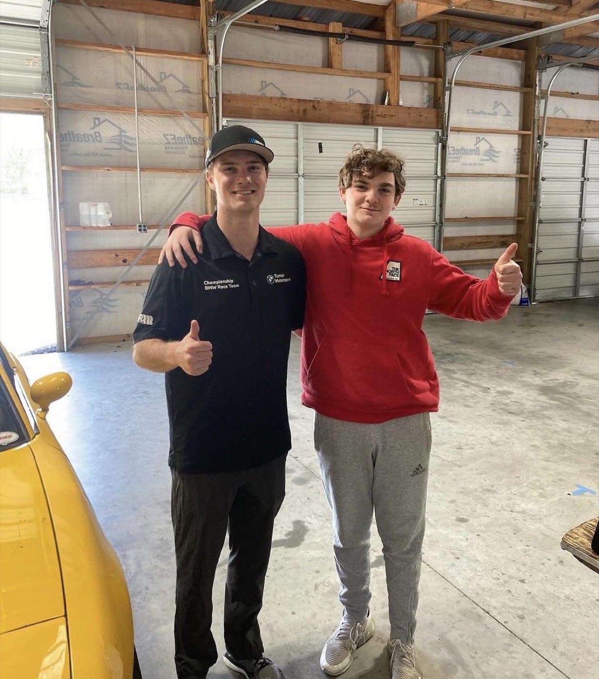 Francis Selldorff with a driver he coaches at Thompson Speedway