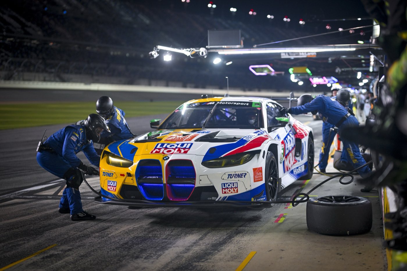 Night pit stop for the #96 BMW M4 GT3 EVO at the Rolex 24